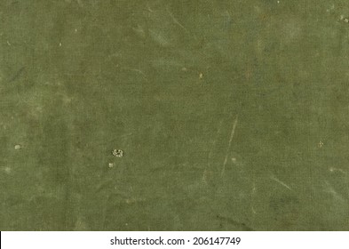 Olive green cotton texture with scratches ans rips