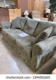 Olive Green Sofa In Second Hand Store