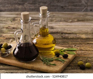 olive oil and balsamic vinegar on a wooden background - Powered by Shutterstock