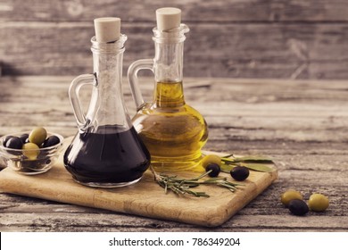 olive oil and balsamic vinegar on a wooden background - Powered by Shutterstock