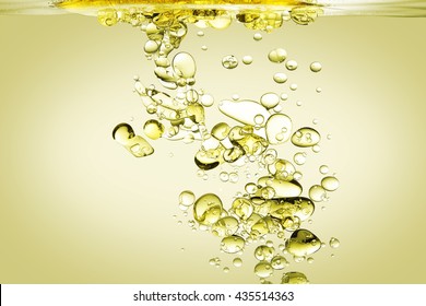 Olive Oil Being Poured Into Water