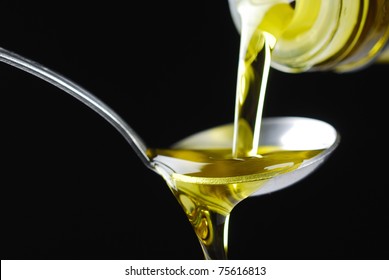  Olive Oil Being Poured Onto A Spoon