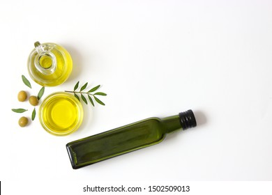 Olive Oil In A Bottle On A White Background Top View.
