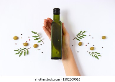 Olive Oil In A Bottle On A White Background Top View.
