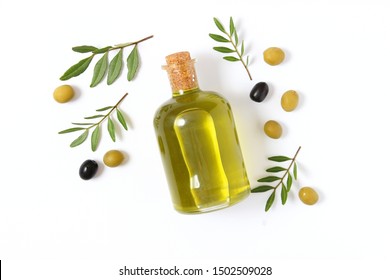 Olive Oil In A Bottle On A White Background Top View.
