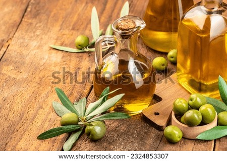 Olive oil and olive branch. extra virgin olive oil jars on a wooden background. place for text. Zdjęcia stock © 