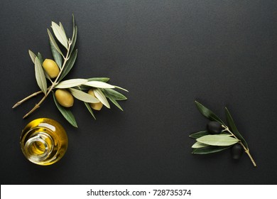 Olive Oil And Olive Branch On Black Background