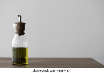 Olive Oil Dispenser. Healthy Fats Concept.