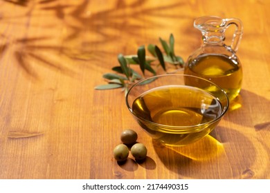 Olive oil and olive fruits. - Shutterstock ID 2174490315