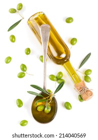 Olive Oil In A Glass Bottle And Green Olives Isolated On White, Top View.