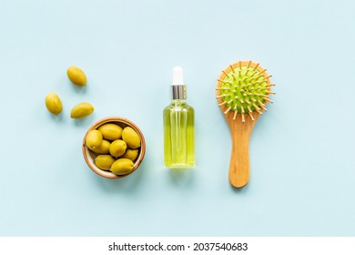 Olive Oil For Hair Treatment With Wooden Hair Brush