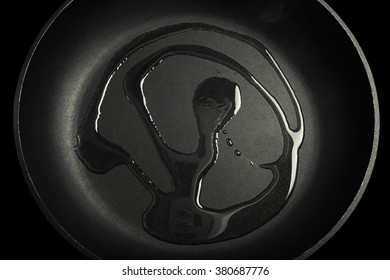 Olive Oil On Black Frying Pan. Toned.