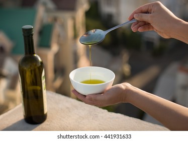 Olive oil over an Italian city background