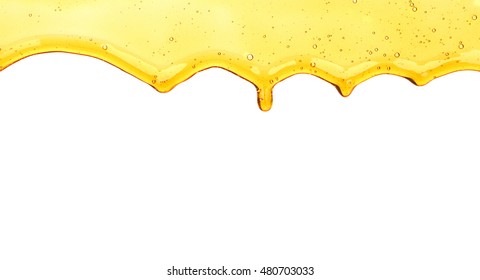 Olive Oil Pouring In Bowl On White Background