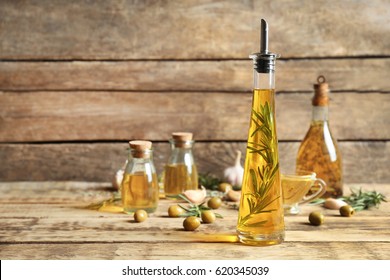 Olive Oil With Spices On Wooden Background