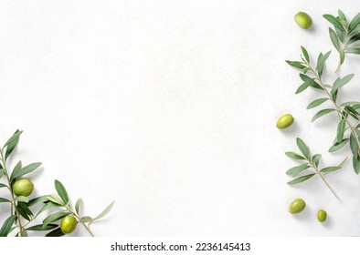 Olives and olive branches on white textured background. Background with olive leaves for your package and design. - Shutterstock ID 2236145413