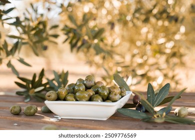 Olives on table in an olive grove - Powered by Shutterstock