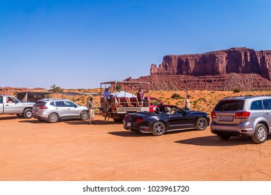 Oljato-Monument Valley, Arizona / USA - June 28 2017: Tourist Cars And Tourists On A Dusty Road In The Monument Valley, Utah. Tour To The Landmarks Of The Wild West USA. Navajo Tribal Park