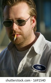 Ollie... A Smoking Labourer/mechanic/workman With His Name Embroidered On His Shirt.