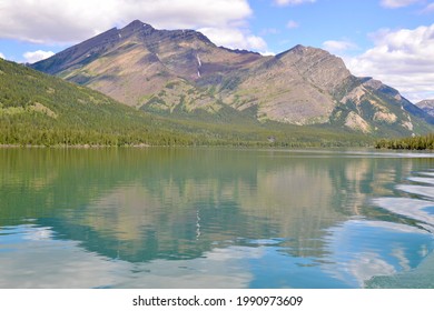Olson Mountain reflecting on Upper Waterton Lake at Glacier National Park during Summer