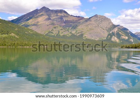 Olson Mountain reflecting on Upper Waterton Lake at Glacier National Park during Summer