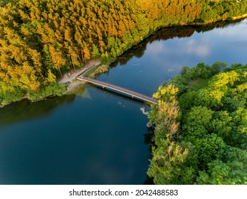 Olsztyn Lake Dlugie, bird's eye view. Wooded shores, the sky reflecting in the water table and a bridge over the lake - Warmia and Masuria, Poland - Shutterstock ID 2042488583
