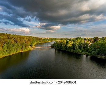 Olsztyn Lake Dlugie, bird's eye view. Wooded shores, the sky reflecting in the water table and a bridge over the lake - Warmia and Masuria, Poland - Shutterstock ID 2042488601
