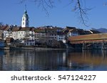 Olten, Solothurn, Switzerland - December 29, 2016: View of Olten old city and wooden foot bridge across the Aare River on sunny winter day