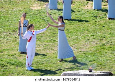 Olympia, Greece -  March 12, 2020: Olympic Flame Handover Ceremony For The Tokyo 2020 Summer Olympic Games At The Ancient Olympia Site, Birthplace Of The Ancient Olympics In Southern Greece.