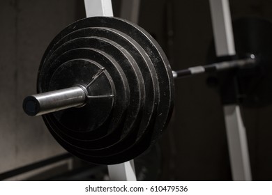 An Olympic barbell with weights.