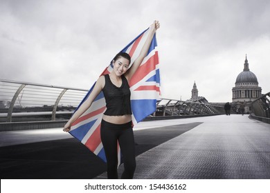 Olympic competitor with Union Jack in front of St Paul's Cathedral in London