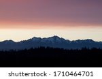 The Olympic Mountain range at sunset photographed from an overlook near Shelton, WA, USA.