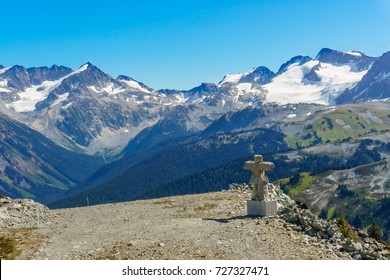 An Olympic Statue On Whistler Mountain With Blackcomb Mountain In The Background. Whistler, British Columbia, Canada. Landscape Photography.