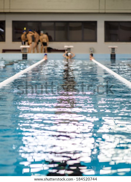 an olympic swimming\
pool as a background