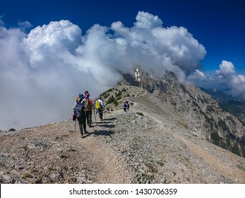 OLYMPUS NATIONAL PARK, GREECE - JUNE, 2019: Tourists climbing the Olympus mountain in Greece, Europe