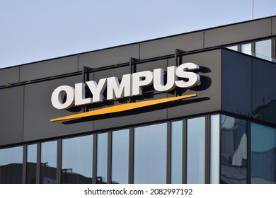 Olympus signage, logo on the facade of Olympus Polska office, Japanese manufacturer of optics and photo technics. WARSAW, POLAND - NOVEMBER 28, 2021