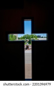 Omaha, Nebraska, US - 5.2022 - View Out Of A Cross Window Of St. John's Parish Catholic Church On The Campus Of Creighton University.