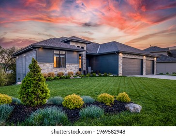 Omaha, Nebraska USA - 5-6-21: Real estate twilight sunset photo of a luxury ranch style home in Omaha Nebraska