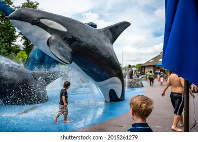 Omaha, Nebraska, USA: 6-2021: Scott Alaskan Adventure splash pad with children playing at the Henry Doorly Zoo and Aquarium