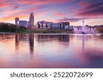 Omaha, Nebraska, USA. Cityscape image of downtown Omaha, Nebraska with reflection of the skyline at beautiful autumn sunset.