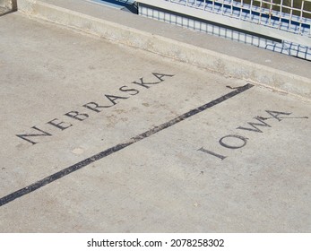 OMAHA, UNITED STATES - Oct 14, 2021: The Nebraska Iowa borderline on the Bob Kerrey Pedestrian Bridge, Omaha, Nebraska