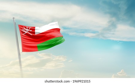 Oman National Flag Waving In Beautiful Sky.