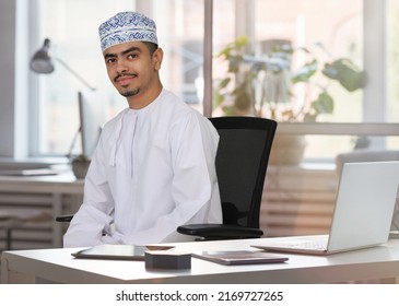 Omani Business Man In Office Looking At Screen