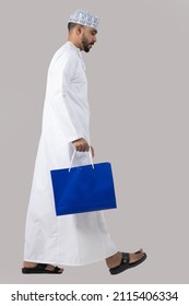 Omani Man Holding Shopping Bag