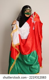 Omani Woman Wearing Traditional Clothes Holding Omani Flag