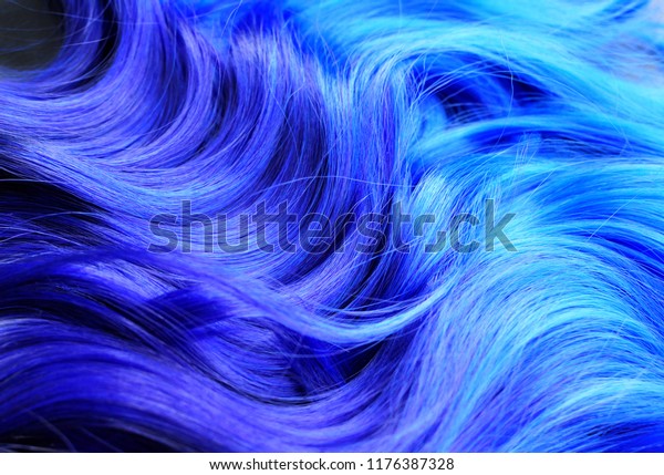 Ombre hair dying black to blue, with  turquoise
highlights, bright vivid colors, such as turquoise and blue, salon
advertising, hair texture