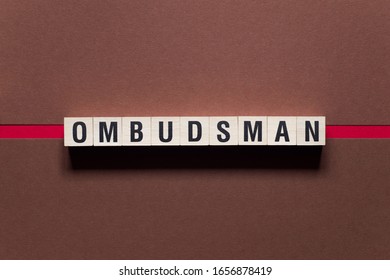 Ombudsman word concept on cubes