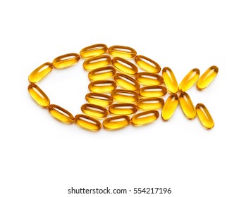 Omega 3 capsules - fish shape, isolated on white background. Top view, copy space, high resolution product. Health care concept - Shutterstock ID 554217196
