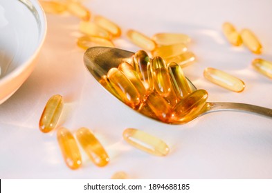 Omega 3 Fish Oil Supplement Capsules Isolated On A White Background Macro.