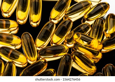 Omega 3 Gel Capsules On Black From Above